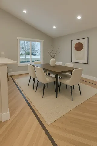 a view of a dining room with furniture and wooden floor