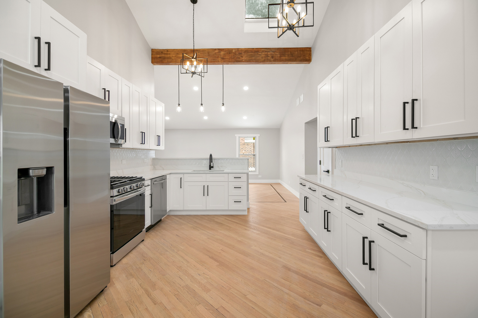 1623 East Street Lockport, IL 60441 - Photo 6 of 31 a large kitchen with stainless steel appliances and white cabinets