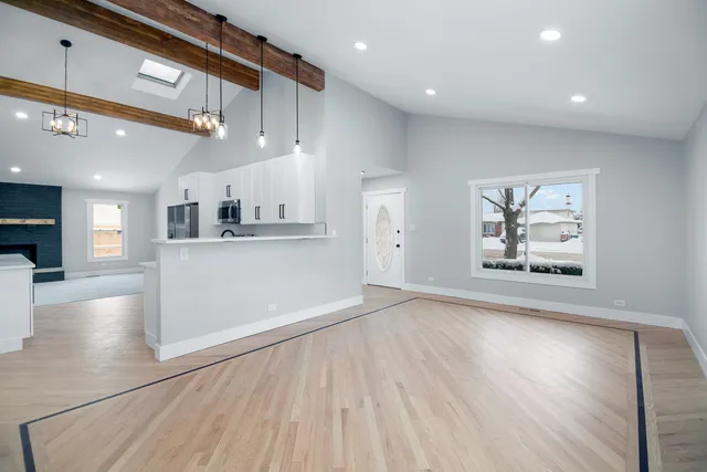 a view of kitchen with cabinets and wooden floor
