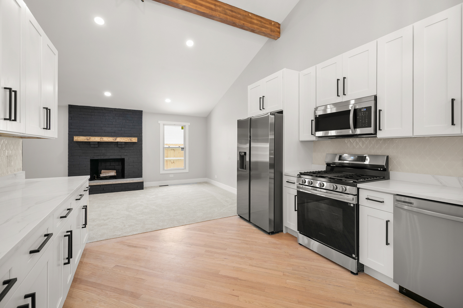 1623 East Street Lockport, IL 60441 - Photo 10 of 31 a kitchen with stainless steel appliances kitchen island granite countertop a refrigerator stove and oven