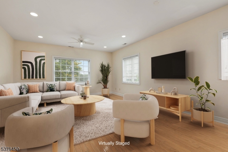 453 Springfield Avenue Berkeley Heights, NJ 07922 - Photo 1 of 34 a living room with furniture a flat screen tv and a window