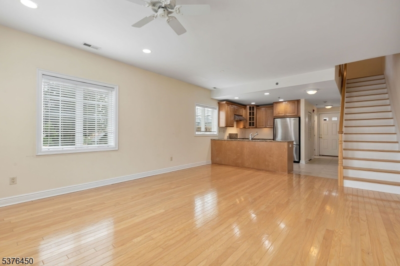 453 Springfield Avenue Berkeley Heights, NJ 07922 - Photo 11 of 34 a view of a livingroom with furniture an empty room and kitchen view