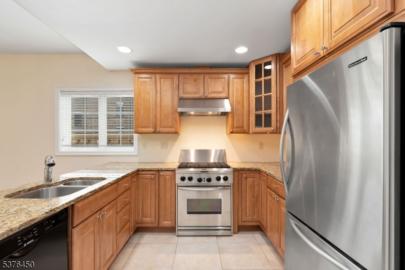 453 Springfield Avenue Berkeley Heights, NJ 07922 - Photo 15 of 34 a kitchen with a stove refrigerator and sink