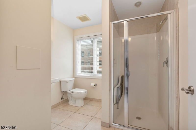 453 Springfield Avenue Berkeley Heights, NJ 07922 - Photo 17 of 34 a bathroom with a toilet sink and shower