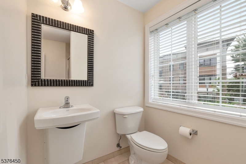 453 Springfield Avenue Berkeley Heights, NJ 07922 - Photo 18 of 34 a bathroom with a toilet sink and mirror