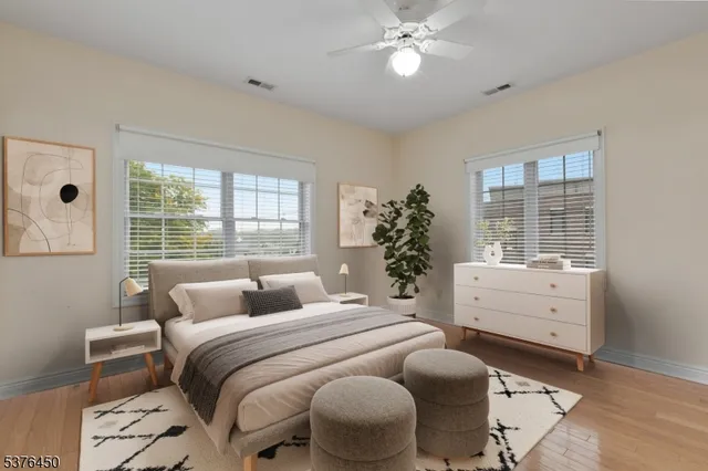 a bedroom with a bed and windows