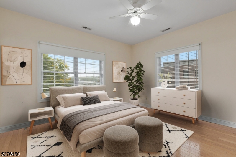 453 Springfield Avenue Berkeley Heights, NJ 07922 - Photo 2 of 34 a bedroom with a bed and windows