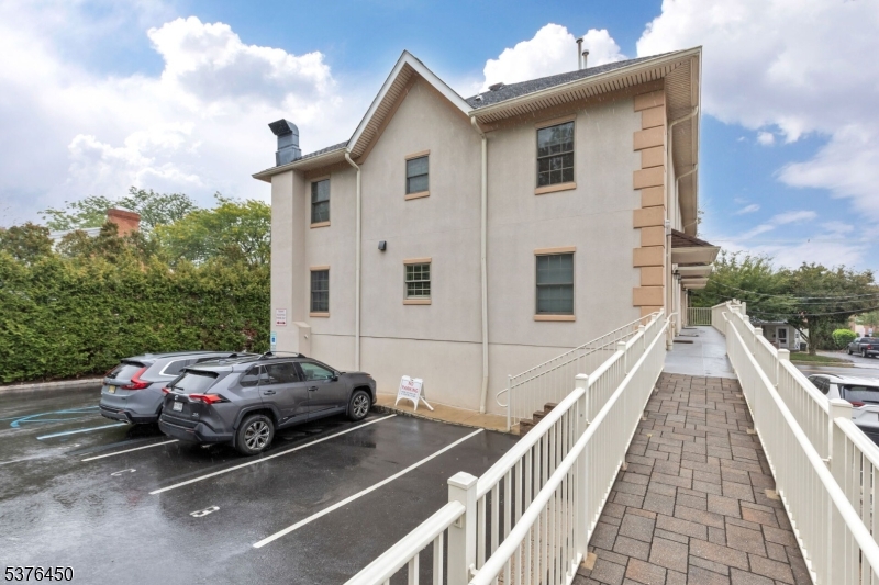 453 Springfield Avenue Berkeley Heights, NJ 07922 - Photo 30 of 34 a view of a white house with a yard