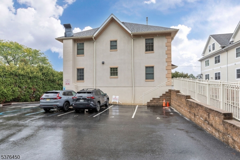 453 Springfield Avenue Berkeley Heights, NJ 07922 - Photo 31 of 34 a car parked in front of a house
