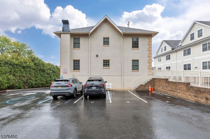 453 Springfield Avenue Berkeley Heights, NJ 07922 - Photo 32 of 34 a car parked in front of a white house