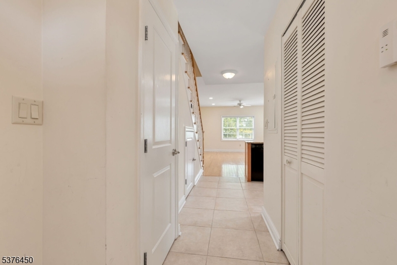 453 Springfield Avenue Berkeley Heights, NJ 07922 - Photo 4 of 34 a view of a hallway with wooden shelves