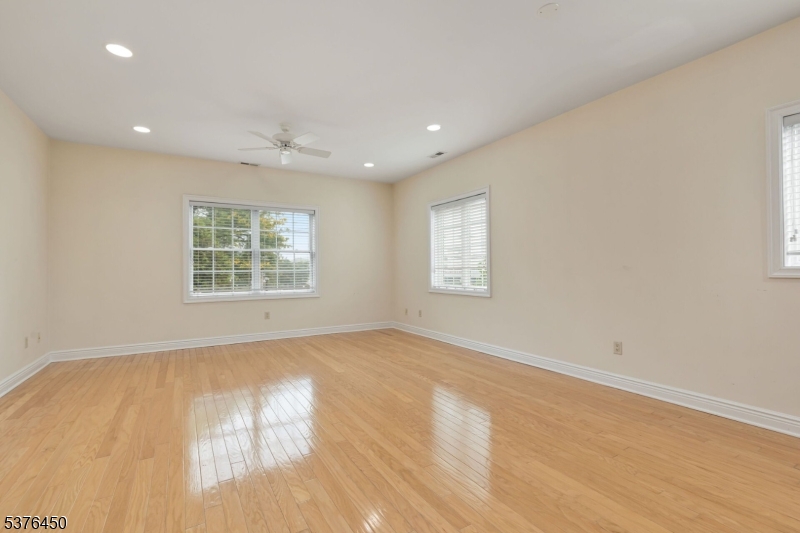 453 Springfield Avenue Berkeley Heights, NJ 07922 - Photo 6 of 34 an empty room with windows
