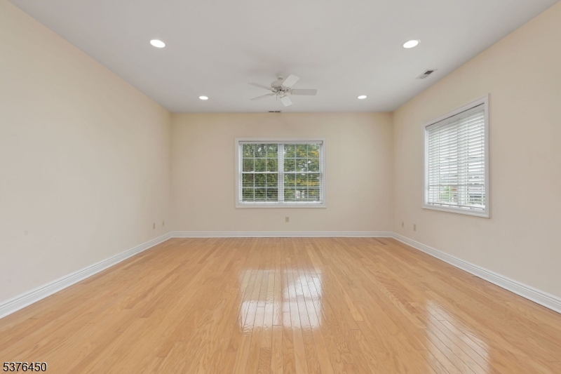 453 Springfield Avenue Berkeley Heights, NJ 07922 - Photo 7 of 34 a view of an empty room with wooden floor and a window