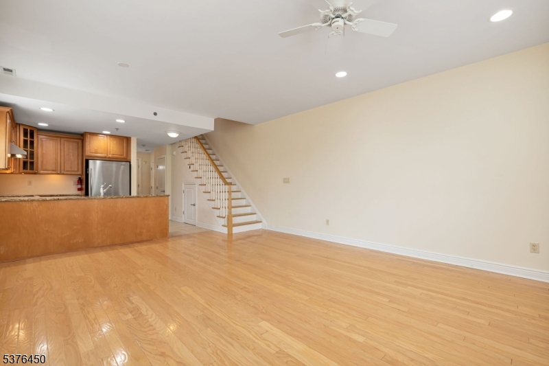 453 Springfield Avenue Berkeley Heights, NJ 07922 - Photo 9 of 34 a view of an empty room with a ceiling fan
