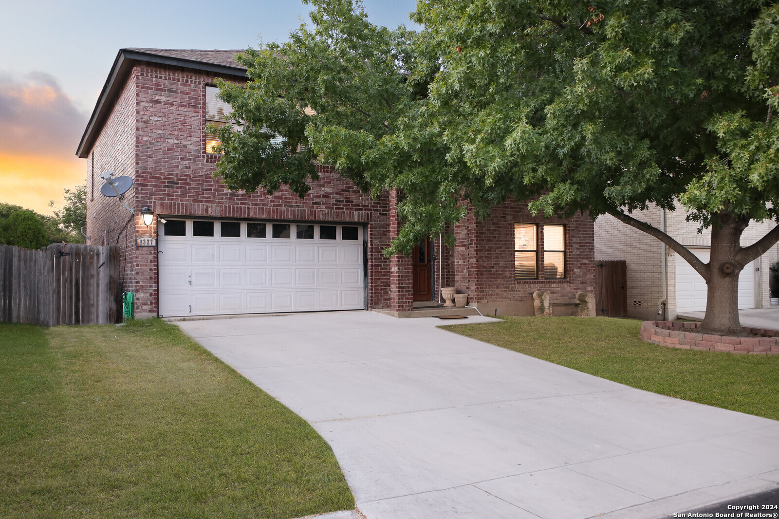 8327 Parry Path Converse, TX 78109 - Photo 1 of 1 a front view of a house with a yard and garage