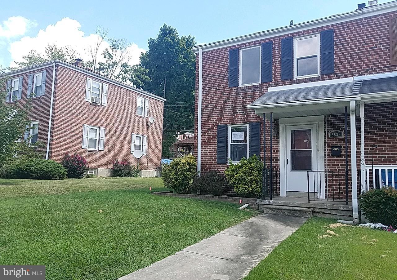8539 Willow Oak Road Baltimore, MD 21234 - Photo 2 of 30 a view of a brick house with a yard