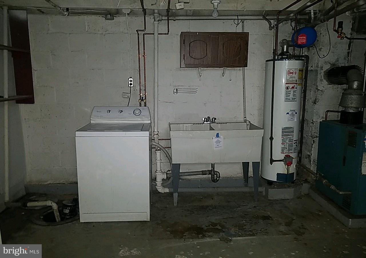 8539 Willow Oak Road Baltimore, MD 21234 - Photo 17 of 30 a utility room with dryer and washer