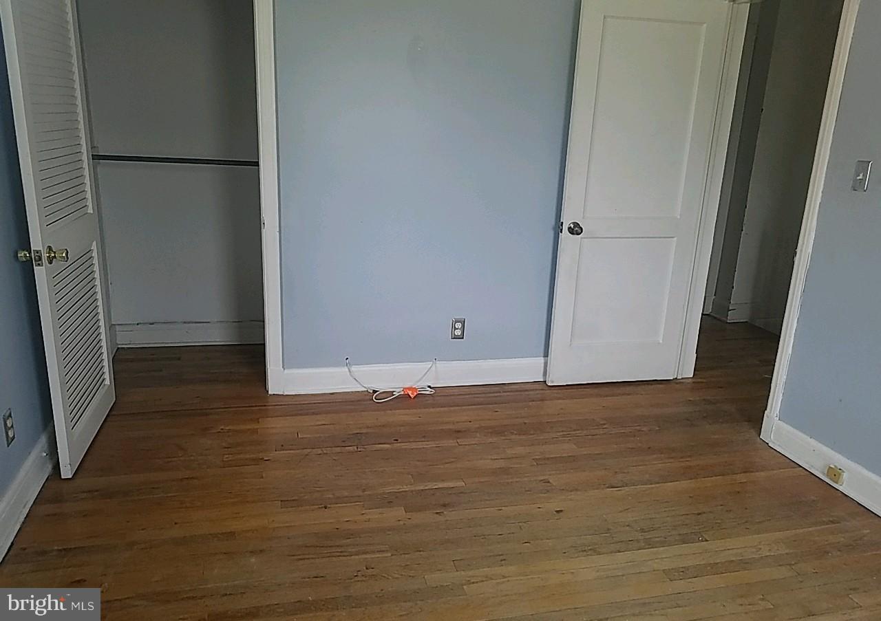 8539 Willow Oak Road Baltimore, MD 21234 - Photo 28 of 30 a view of empty room with wooden floor