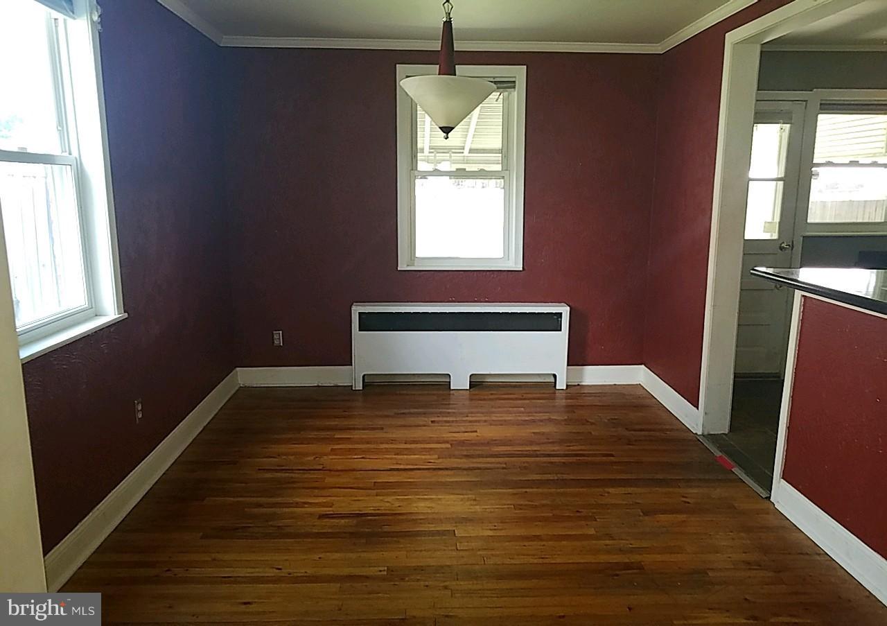 8539 Willow Oak Road Baltimore, MD 21234 - Photo 6 of 30 a view of a livingroom with wooden floor and a window