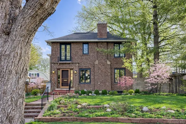 front view of a house with a garden