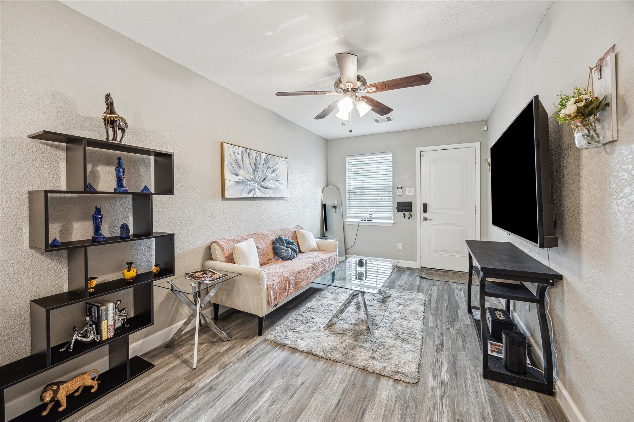 3808 Cochran Street Houston, TX 77009 - Photo 3 of 14 a living room with furniture and a flat screen tv