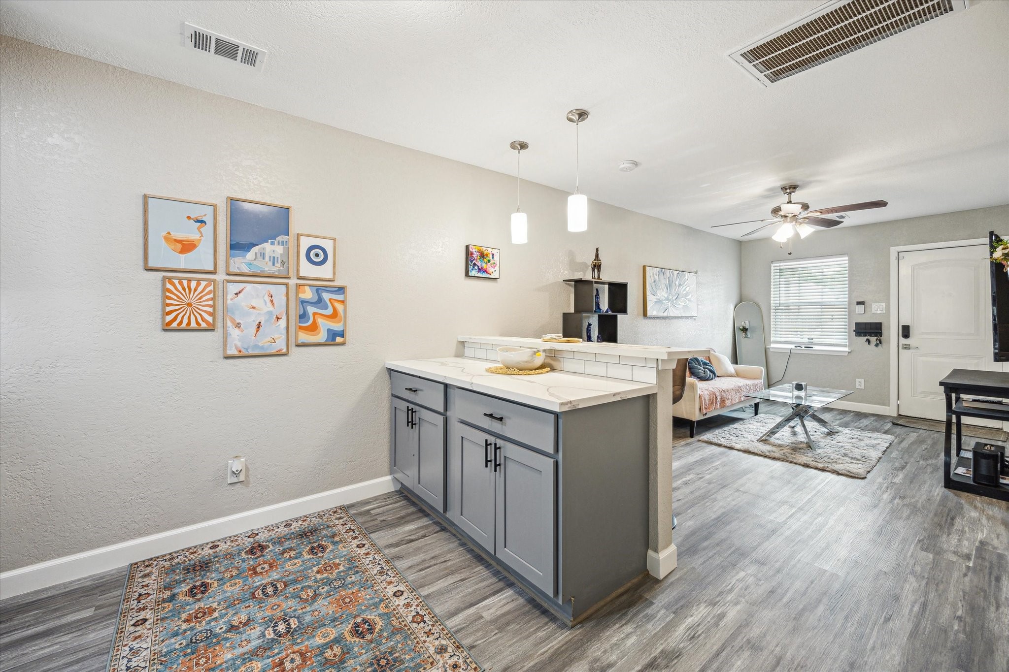 3808 Cochran Street Houston, TX 77009 - Photo 8 of 14 a kitchen with sink cabinets and wooden floor
