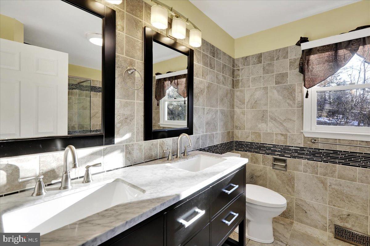 4020 Grant Street Reading, PA 19606 - Photo 24 of 49 Elegant dual-sink bathroom with modern finishes.