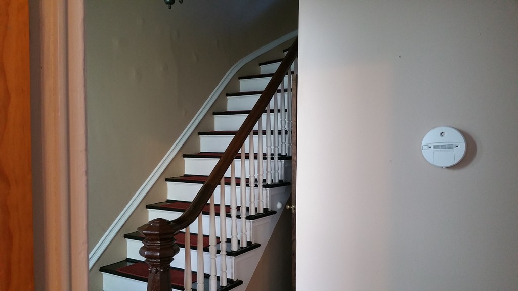 166 Whipple Street Fall River, MA 02721 - Photo 4 of 11 a view of staircase with wooden floor and white walls
