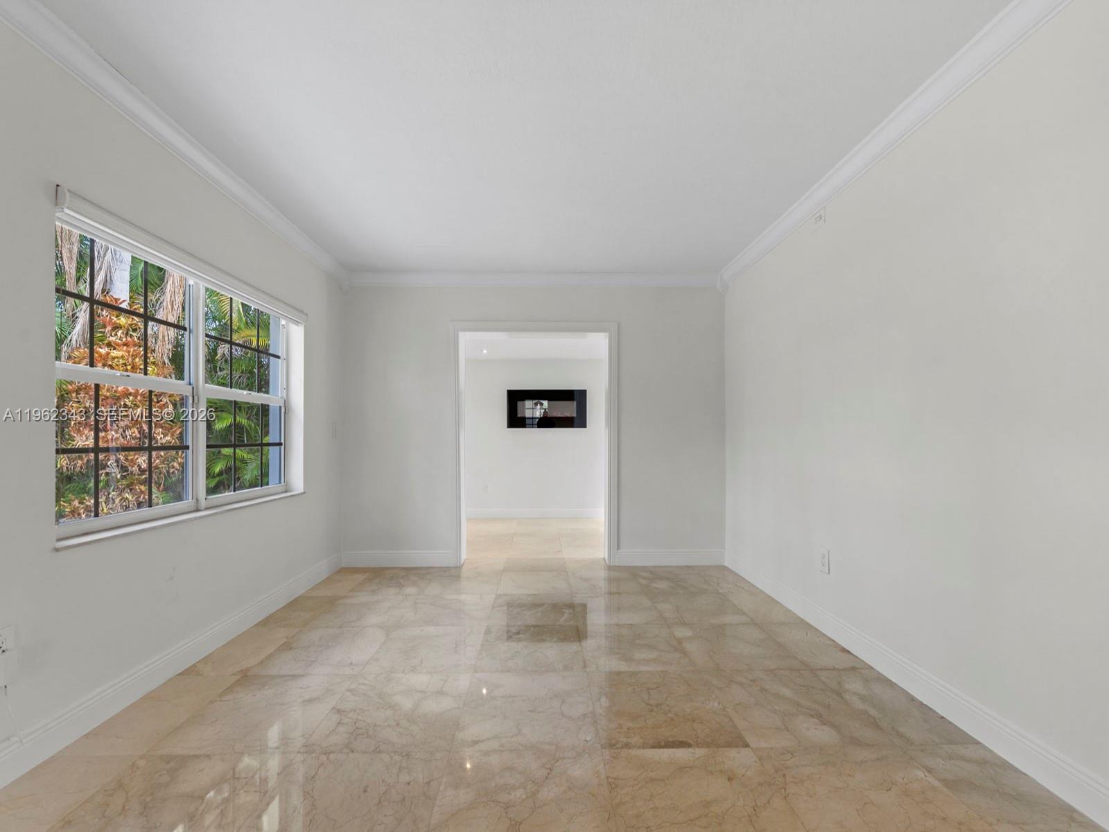 5940 Southwest 47th Street Miami, FL 33155 - Photo 23 of 53 an empty room with windows