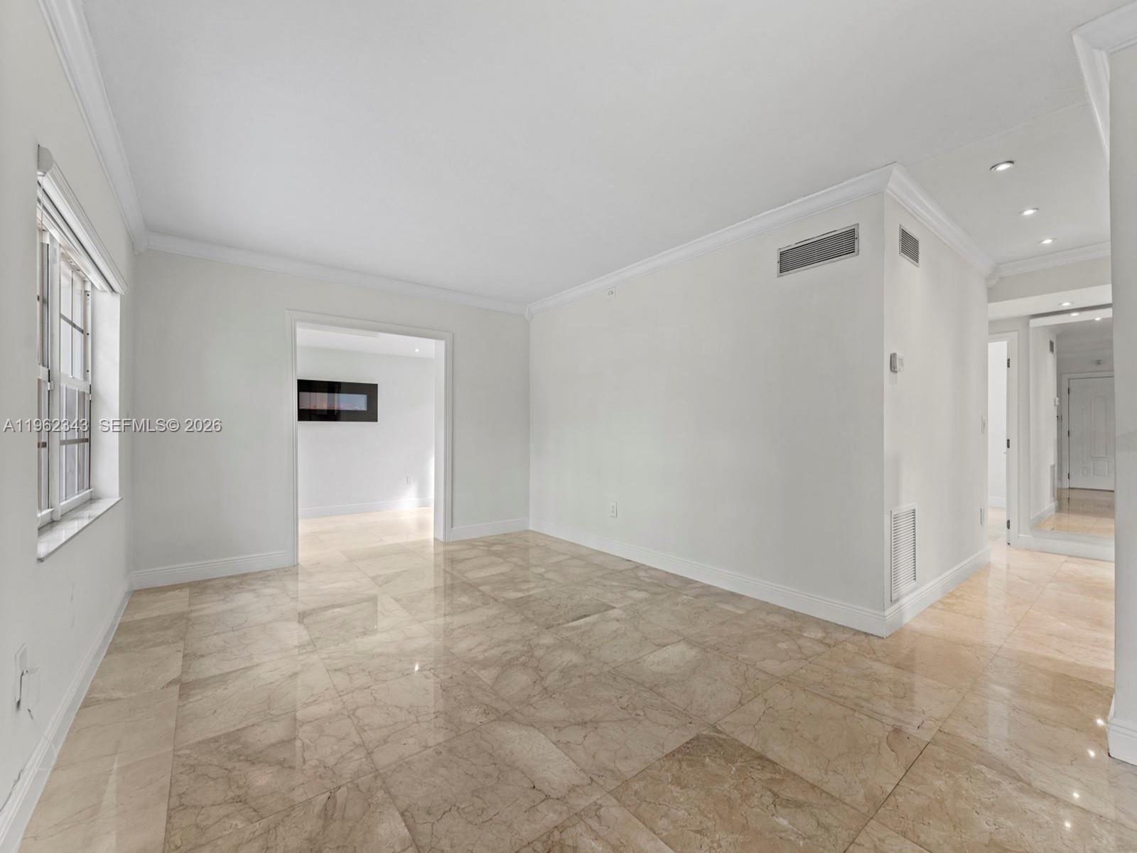 5940 Southwest 47th Street Miami, FL 33155 - Photo 24 of 53 a view of an empty room with a window