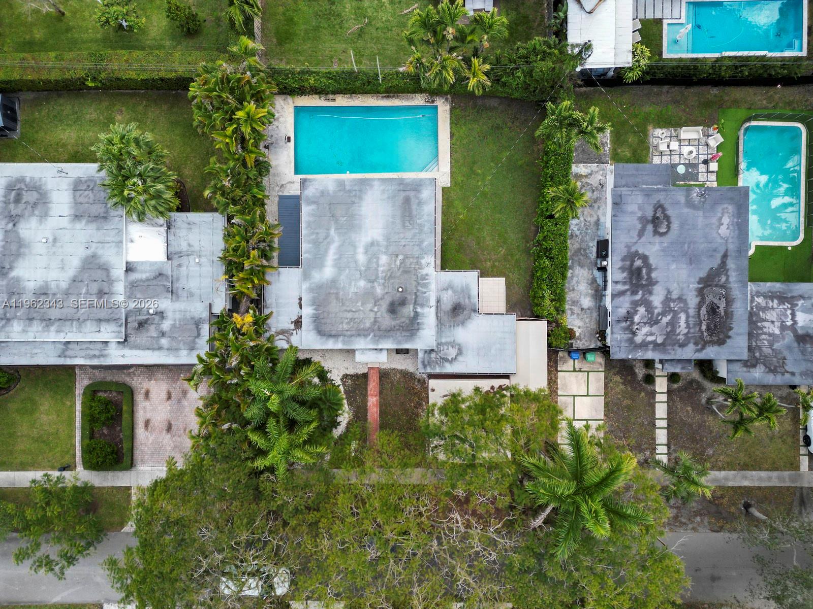 5940 Southwest 47th Street Miami, FL 33155 - Photo 3 of 53 an aerial view of a house with a garden and lake view