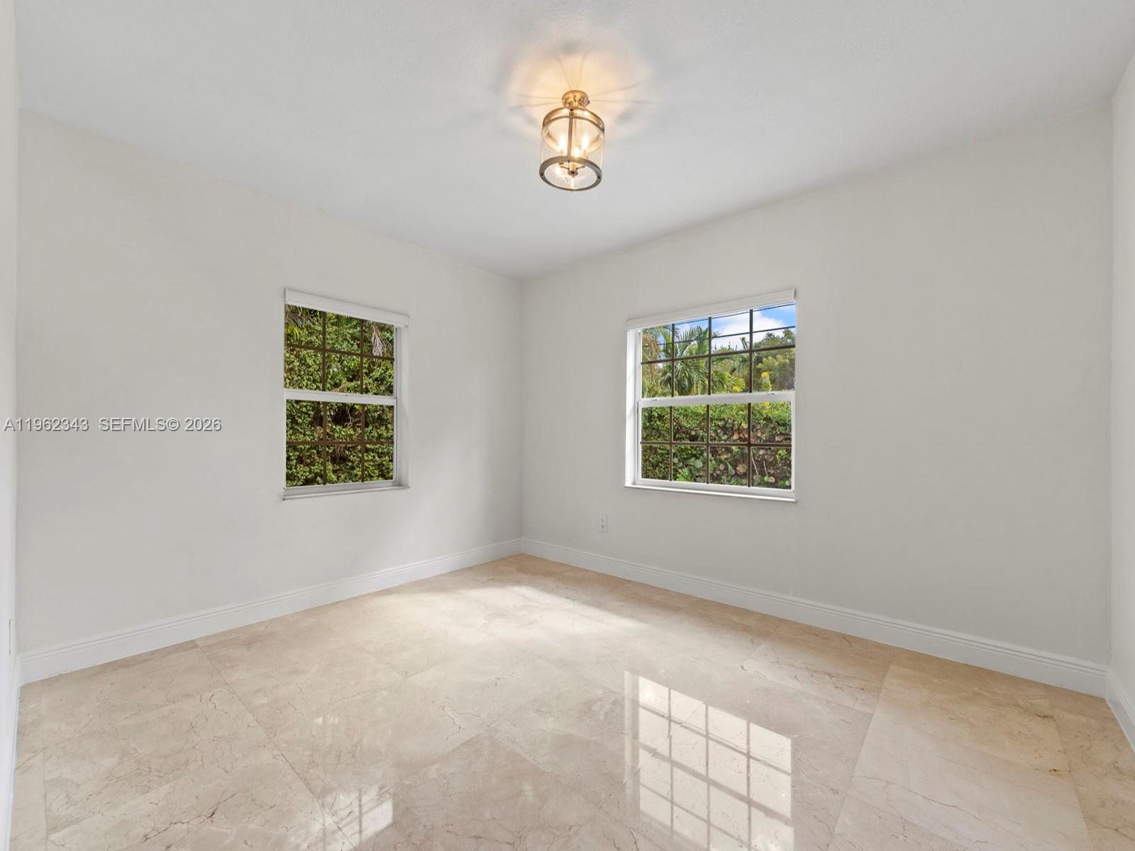 5940 Southwest 47th Street Miami, FL 33155 - Photo 33 of 53 an empty room with windows