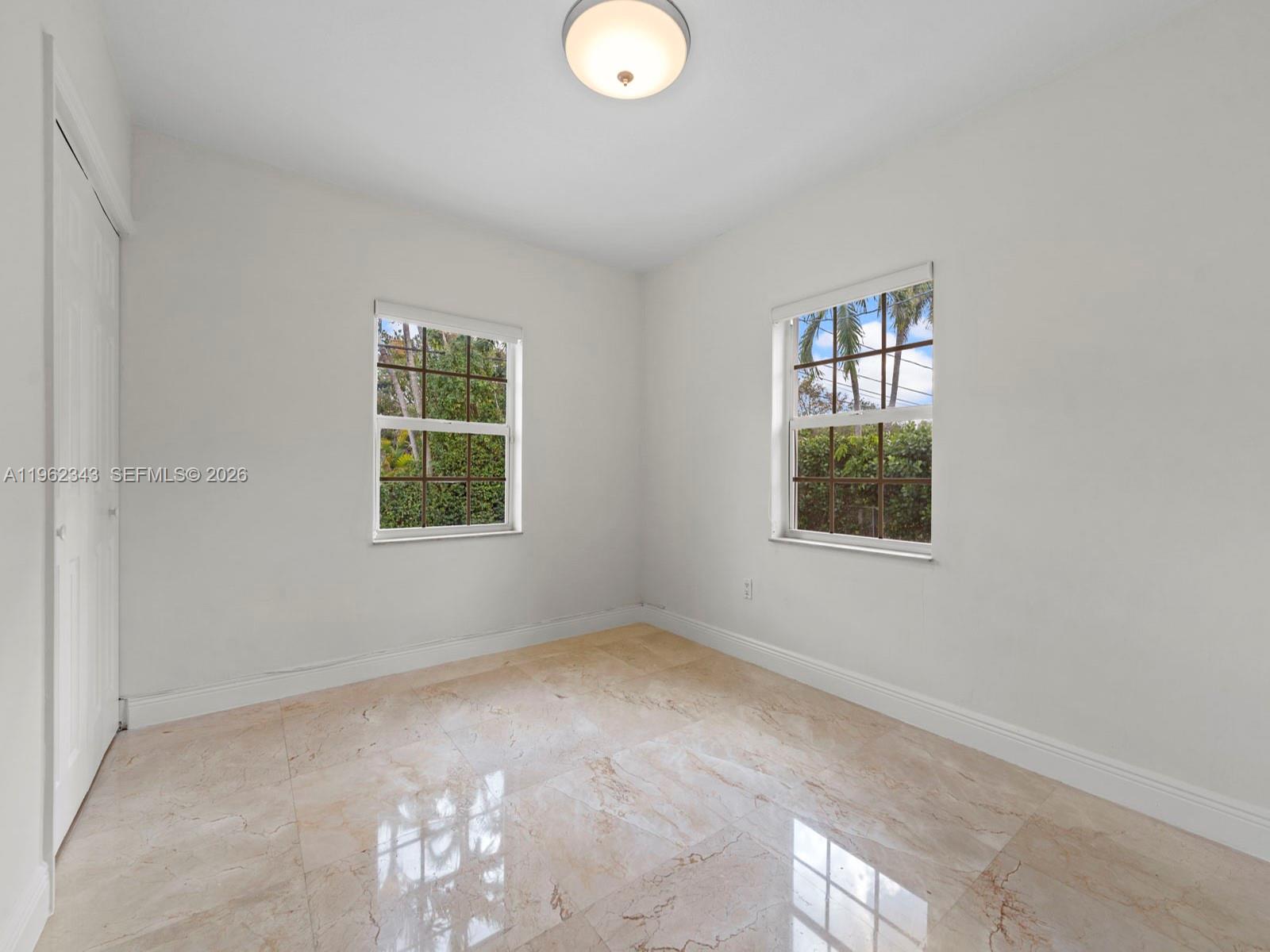 5940 Southwest 47th Street Miami, FL 33155 - Photo 36 of 53 an empty room with windows