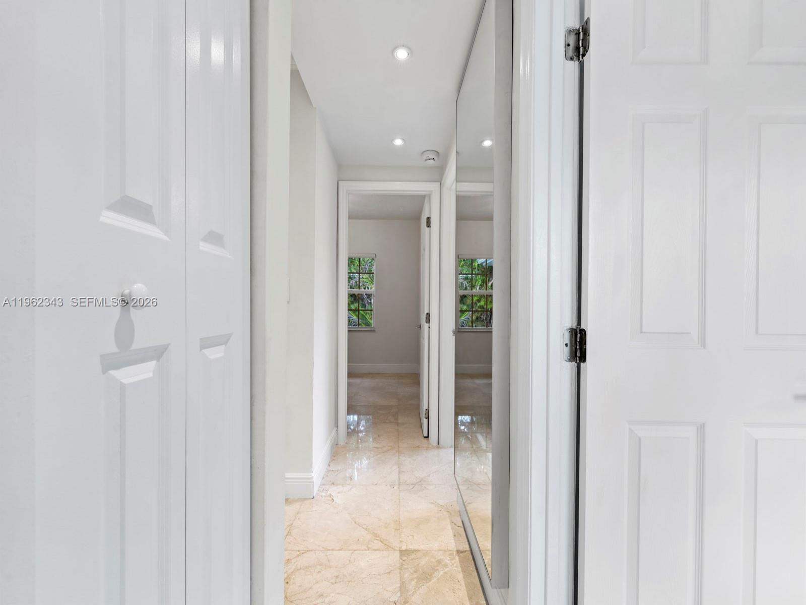 5940 Southwest 47th Street Miami, FL 33155 - Photo 38 of 53 a view of a hallway with closet and a bathroom