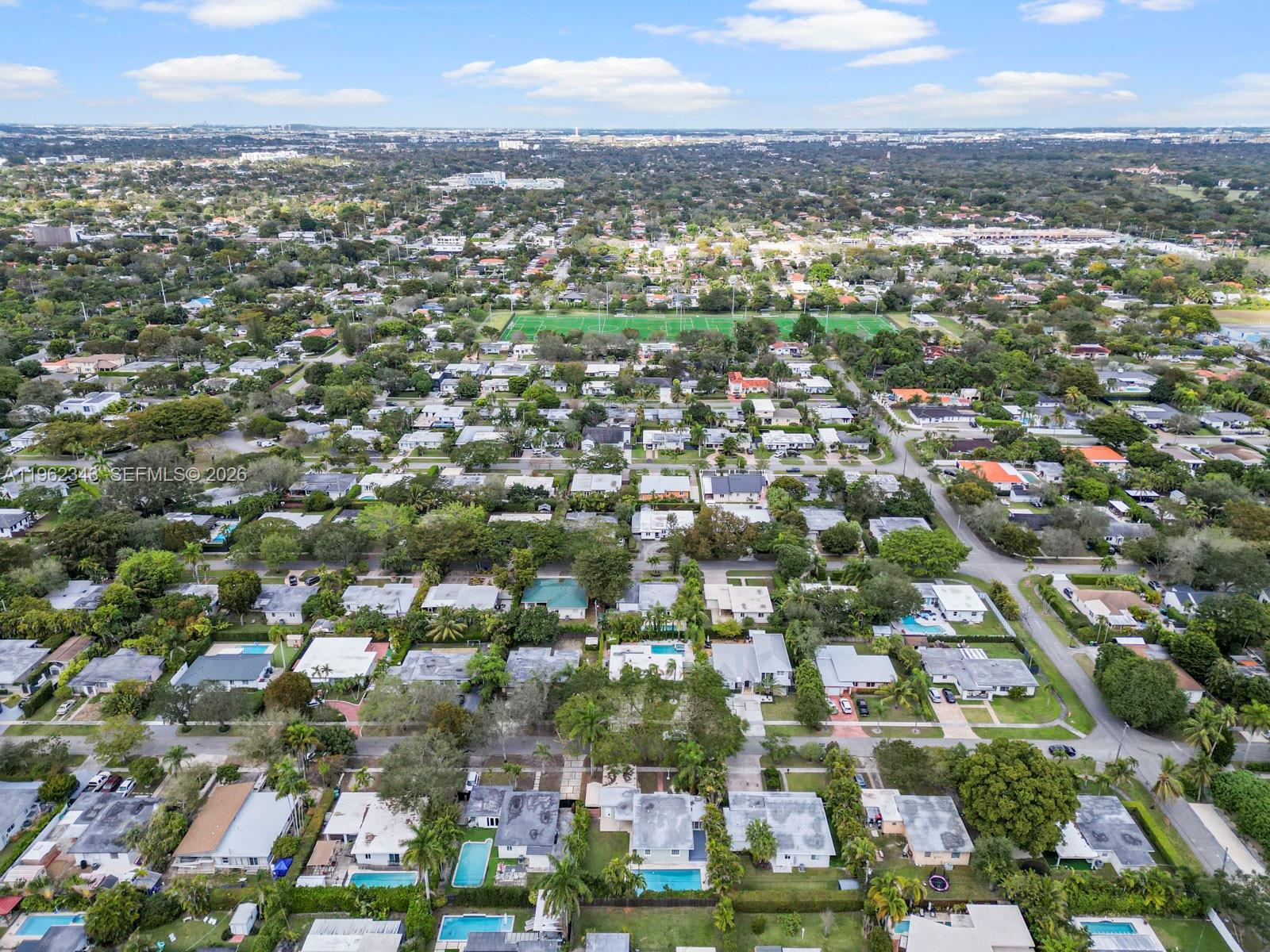 5940 Southwest 47th Street Miami, FL 33155 - Photo 9 of 53 an aerial view of residential houses with city view