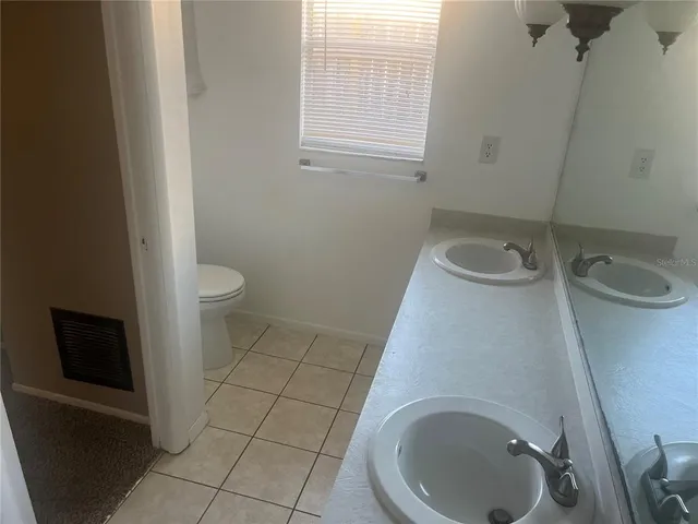 a bathroom with a toilet and a sink