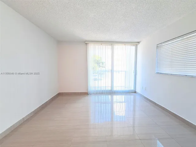 an empty room with a bathroom