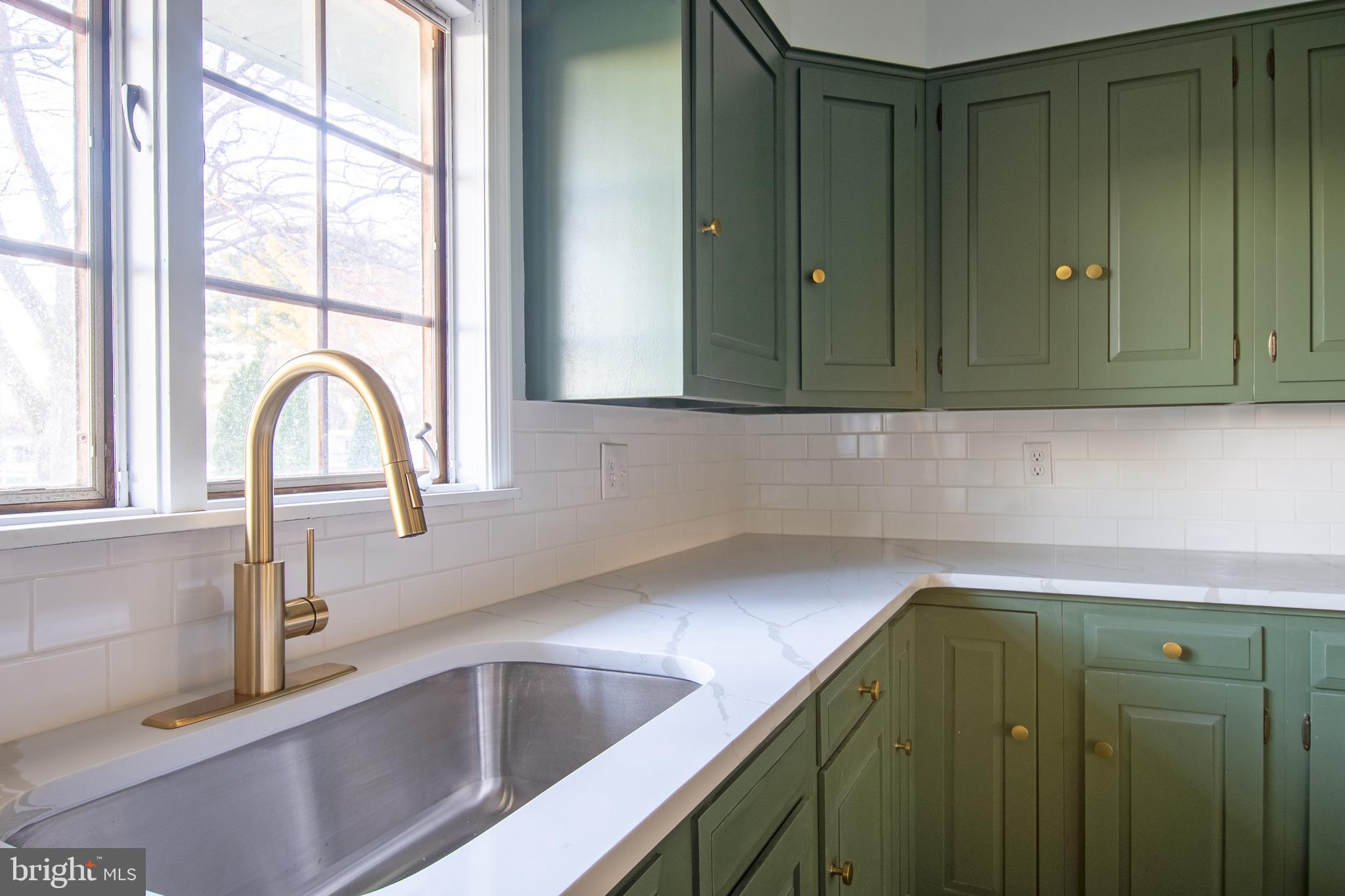 25165 Prettyman Road Georgetown, DE 19947 - Photo 16 of 43 a kitchen with a sink and a large window