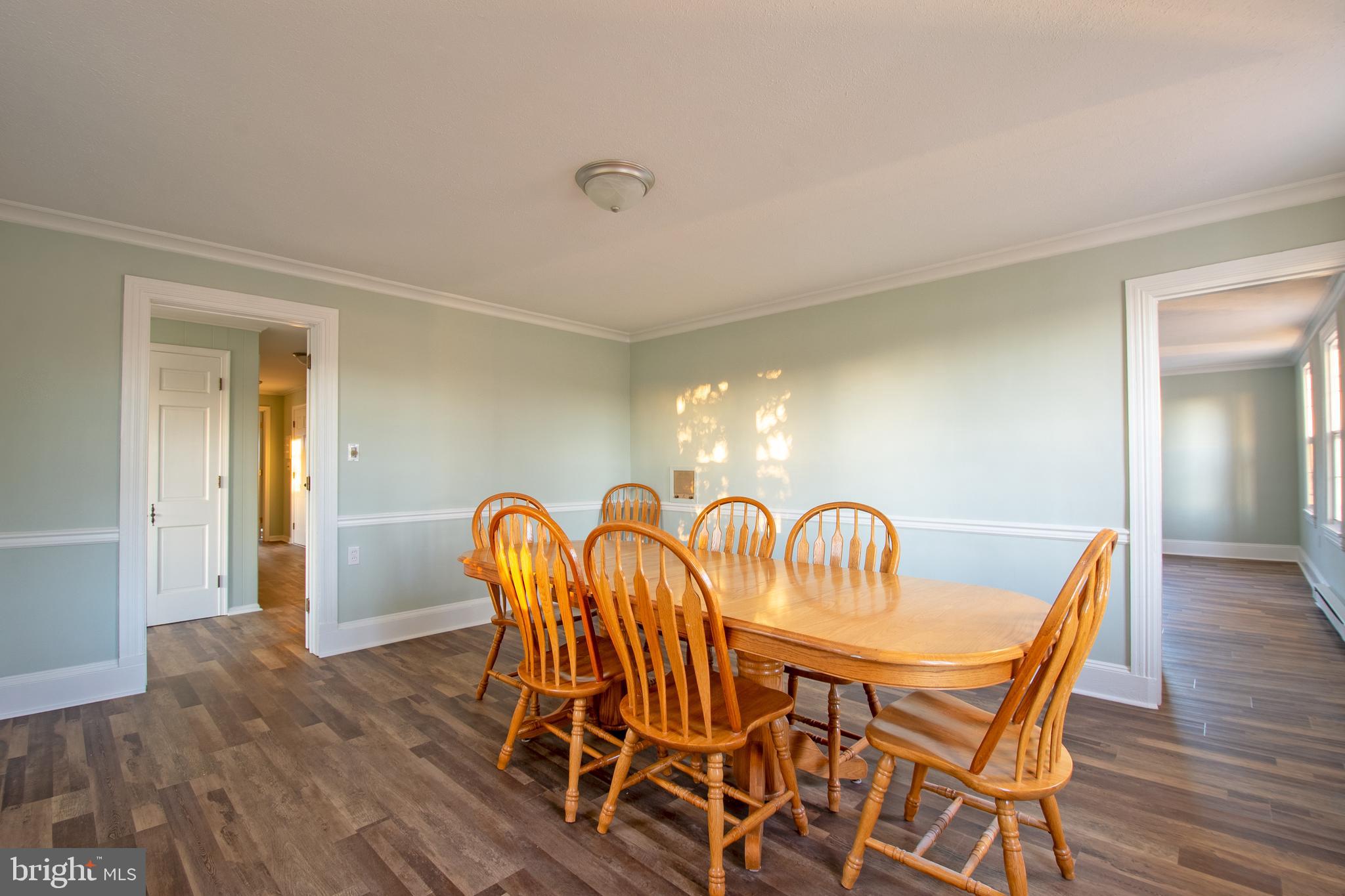 25165 Prettyman Road Georgetown, DE 19947 - Photo 22 of 43 a view of a dining room with furniture and wooden floor