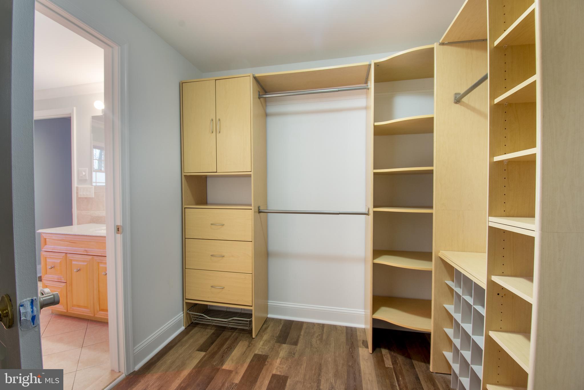 25165 Prettyman Road Georgetown, DE 19947 - Photo 32 of 43 a view of walk in closet with empty racks