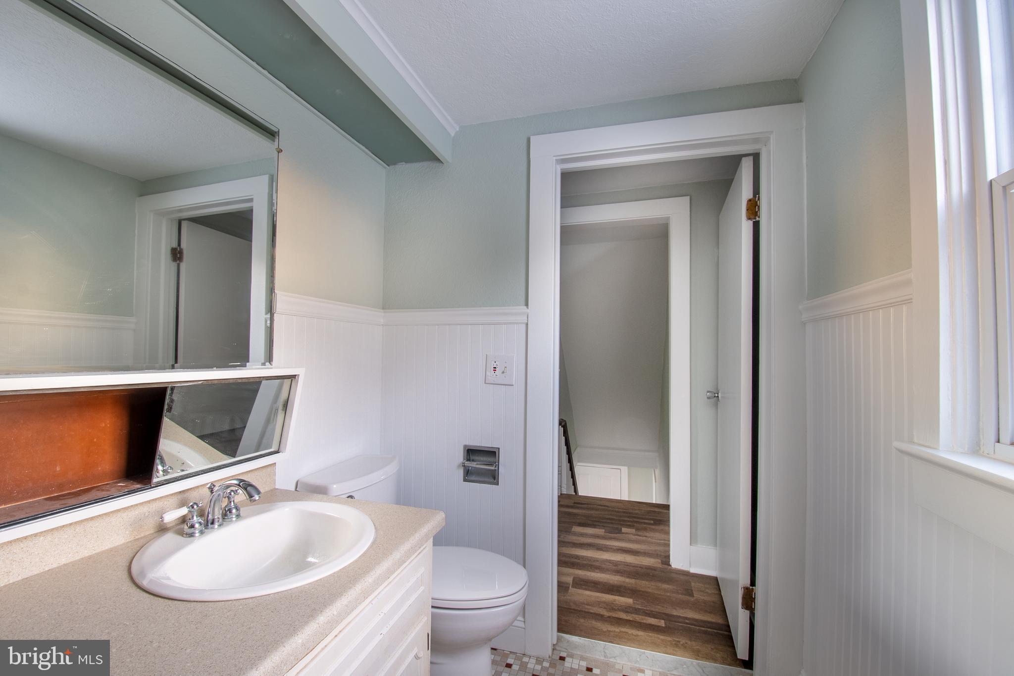 25165 Prettyman Road Georgetown, DE 19947 - Photo 36 of 43 a bathroom with a sink and a mirror