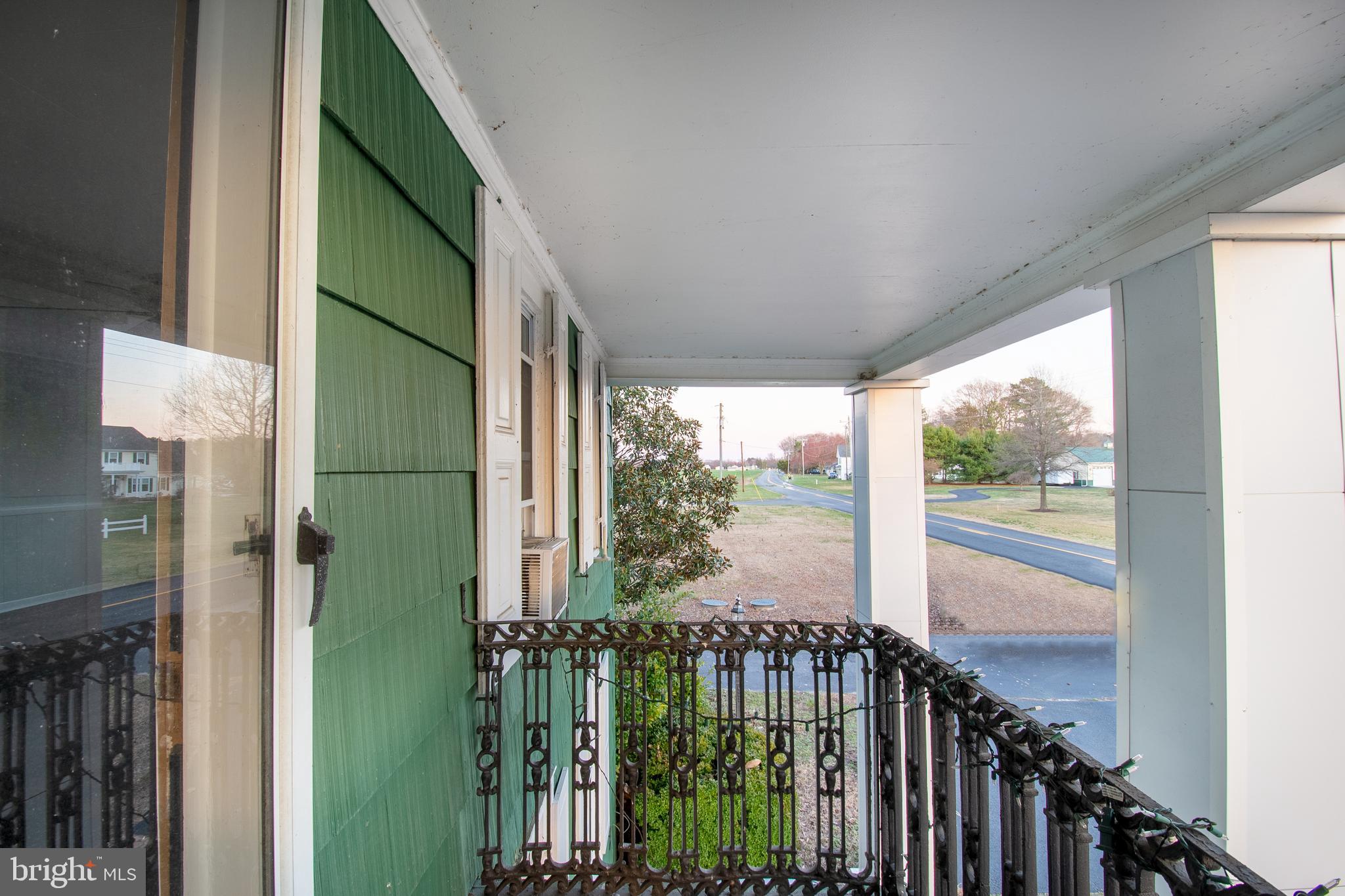 25165 Prettyman Road Georgetown, DE 19947 - Photo 42 of 43 a view of a balcony with an outdoor space