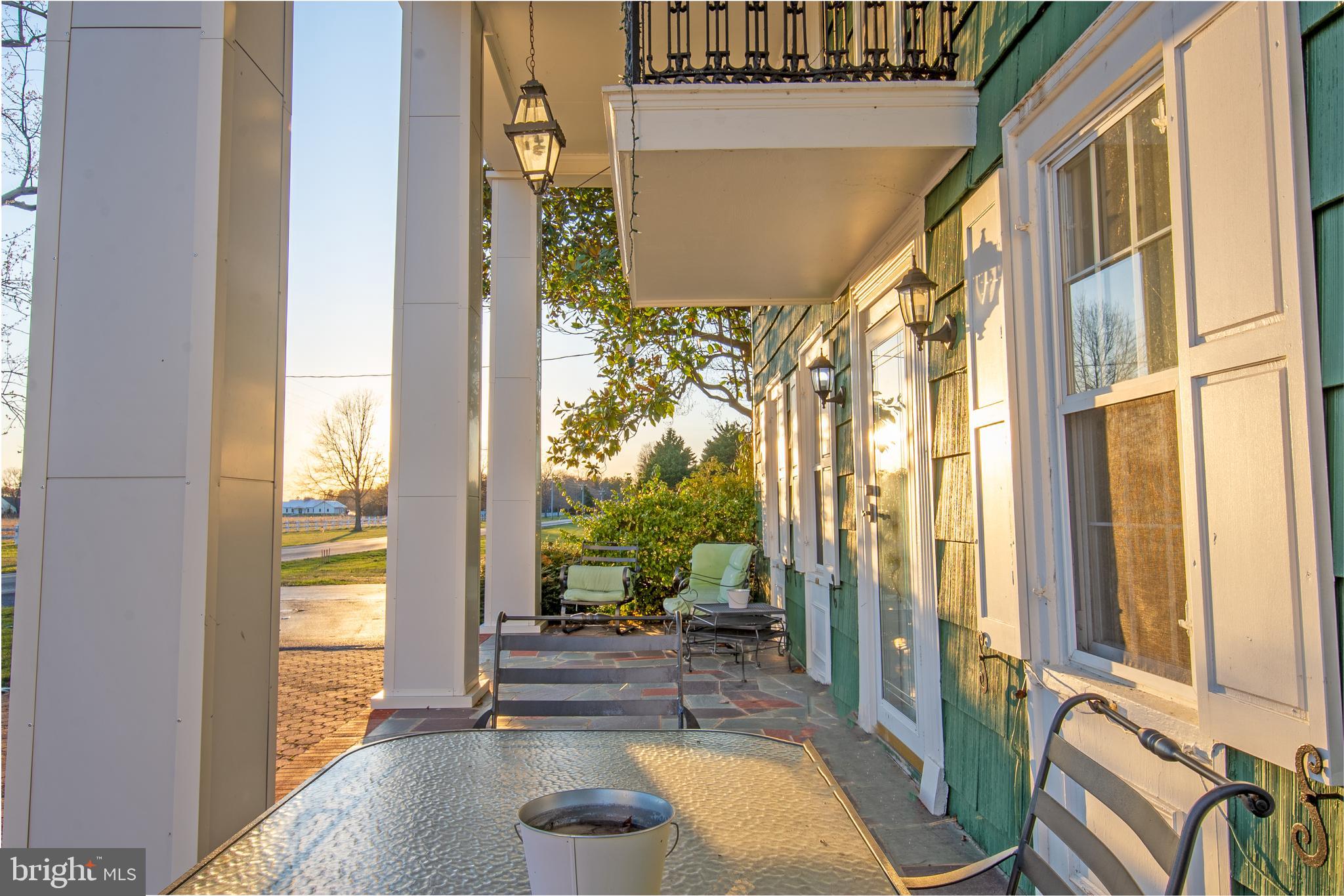 25165 Prettyman Road Georgetown, DE 19947 - Photo 5 of 43 a view of a living room filled with furniture and a floor to ceiling window