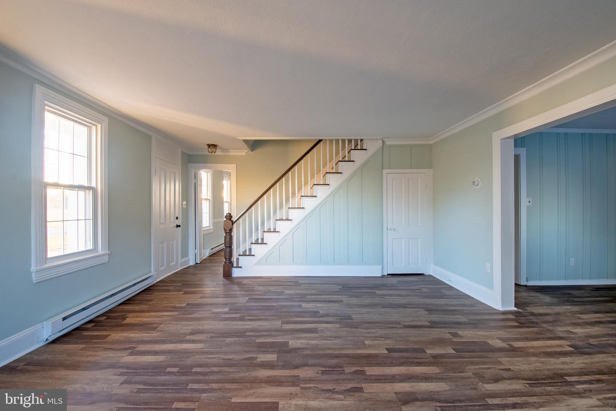 25165 Prettyman Road Georgetown, DE 19947 - Photo 9 of 43 a view of entryway and hall with wooden floor