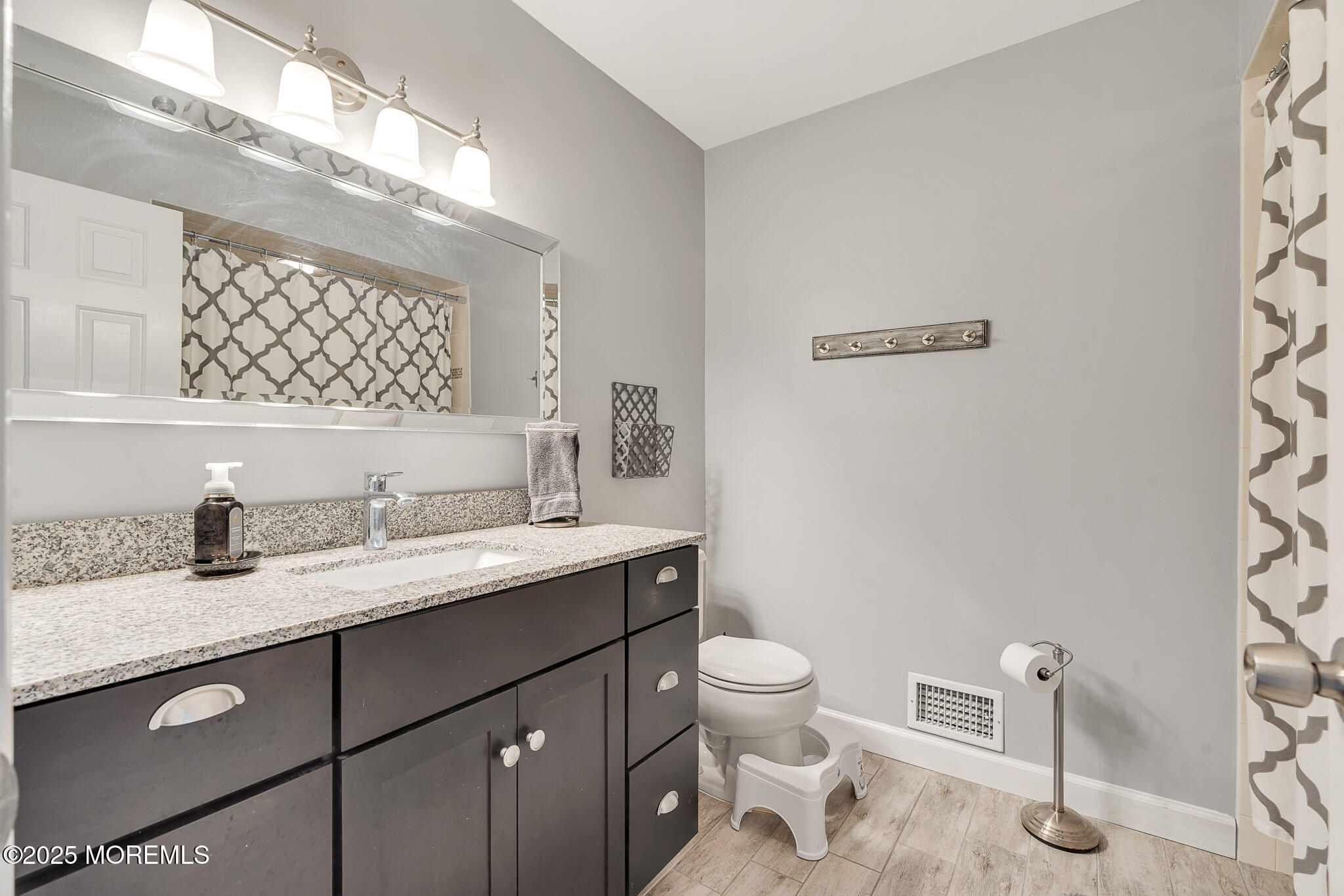 22 A Bedle Road Hazlet, NJ 07730 - Photo 14 of 32 a bathroom with a granite countertop sink mirror vanity and toilet