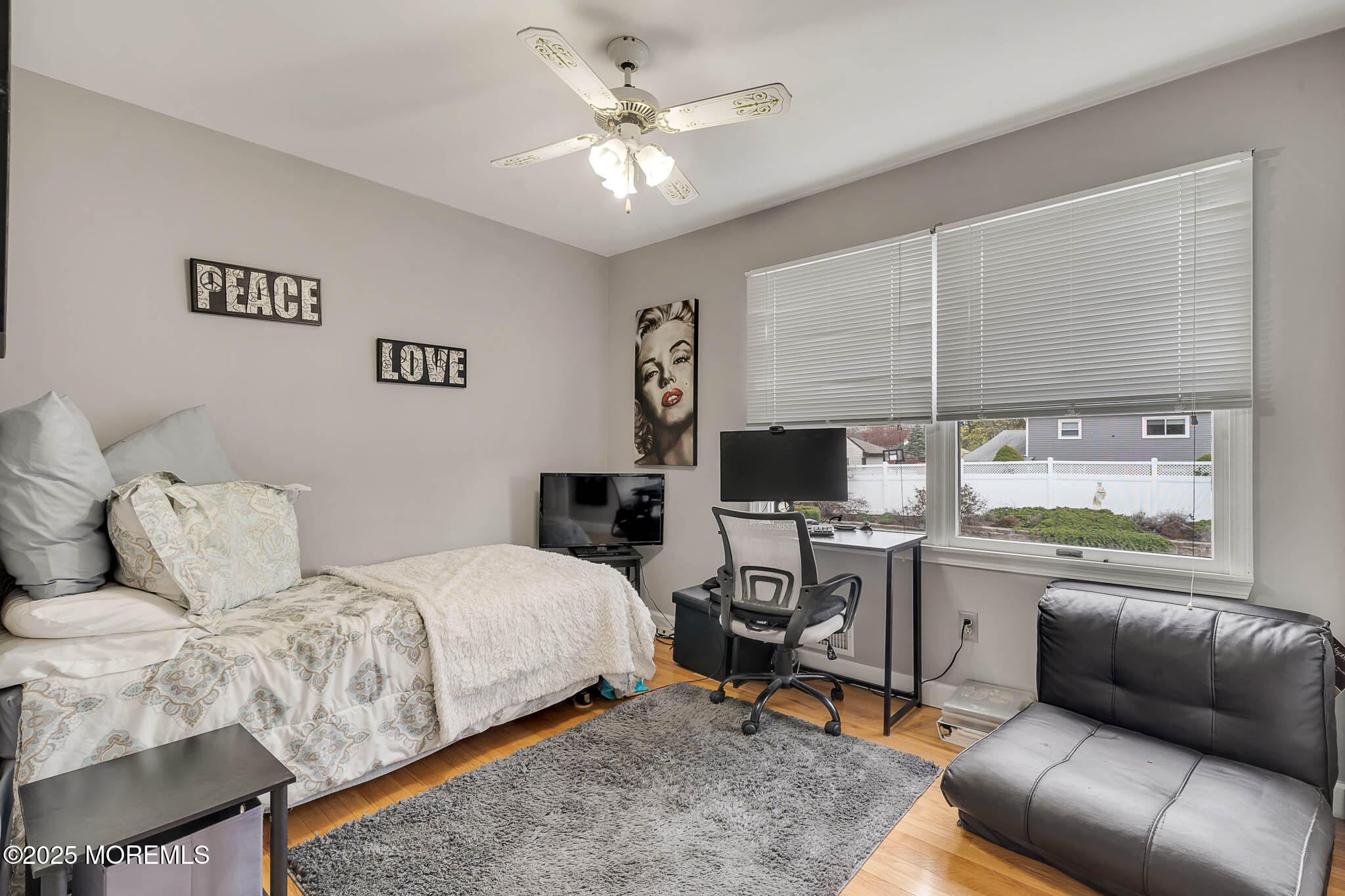 22 A Bedle Road Hazlet, NJ 07730 - Photo 16 of 32 a bedroom with a bed a couch and a window