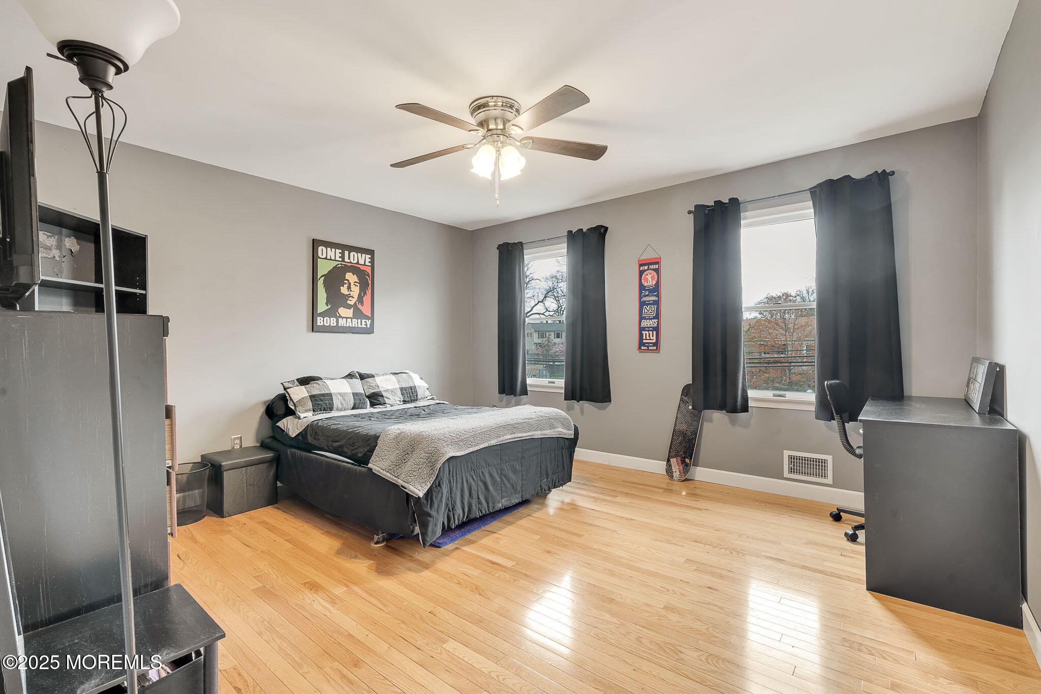 22 A Bedle Road Hazlet, NJ 07730 - Photo 17 of 32 a spacious bedroom with a large bed and a chandelier