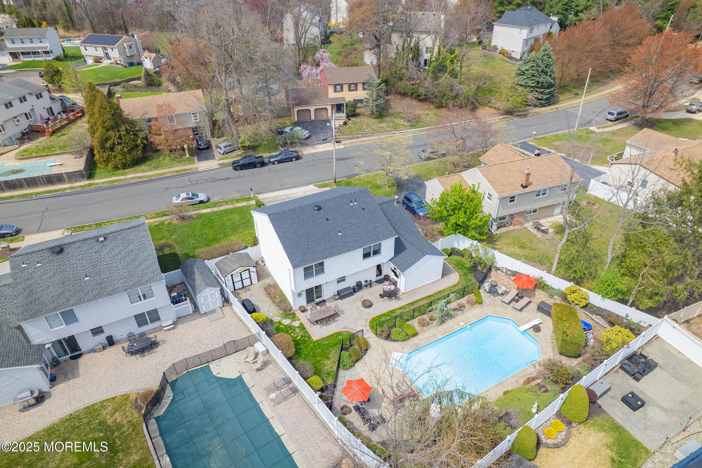 22 A Bedle Road Hazlet, NJ 07730 - Photo 27 of 32 an aerial view of a house with a swimming pool