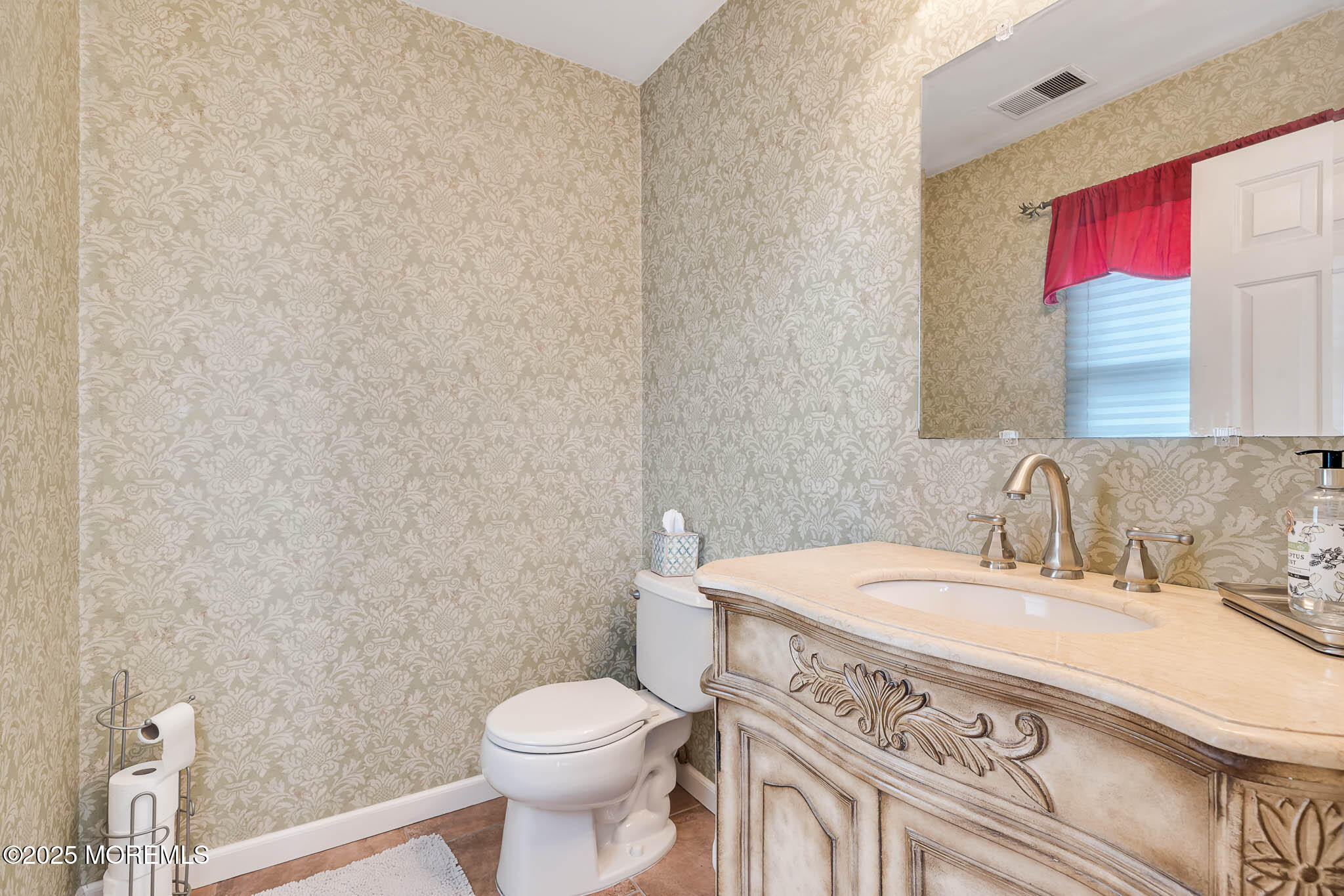 22 A Bedle Road Hazlet, NJ 07730 - Photo 3 of 32 a bathroom with a sink a toilet and a mirror