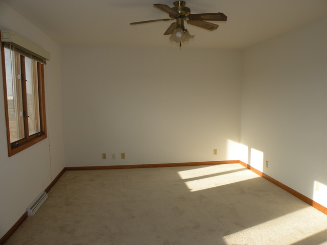 250 Circlegate Road, Unit 250 New Lenox, IL 60451 - Photo 14 of 25 an empty room with a window